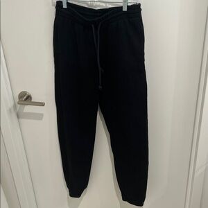 Aritzia; TNA women’s Cozy Fleece Boyfriend Sweatpants - black